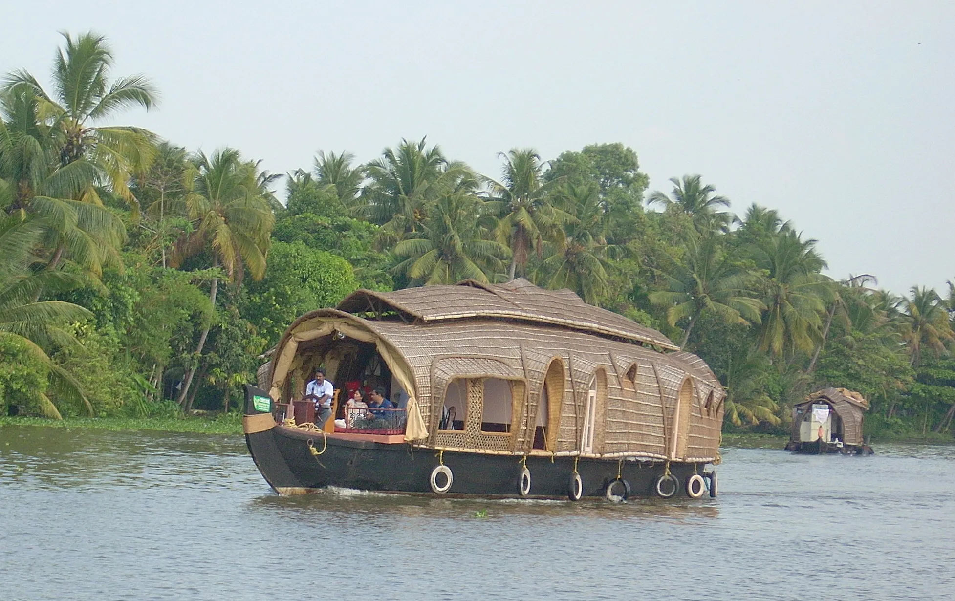 Traditional carved wooden prow of a Kerala houseboat on the backwaters